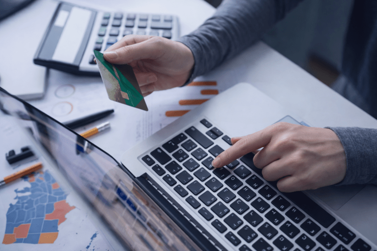 Person Using Laptop and Credit Card for Healthcare Billing or Payment Processing